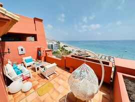 Ático dúplex en primera línea de playa frontal al mar en la Urbanización Punta del Faro II en Torrox Costa